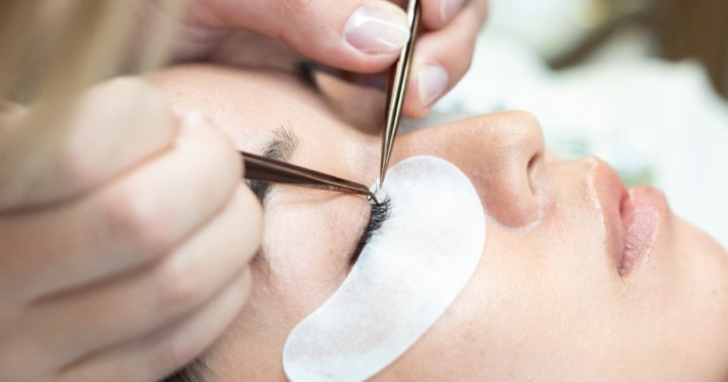Apply natural looking eyelash extensions one-by-one.
